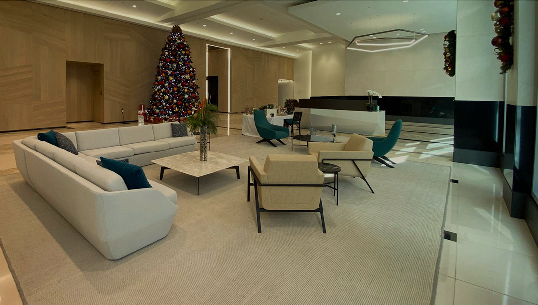Custom rug anchoring the seating in an open residential lounge